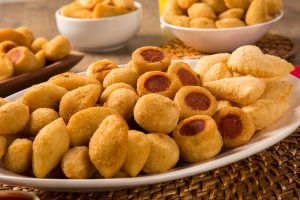 mixed-brazilian-snacks-fried-wooden-background